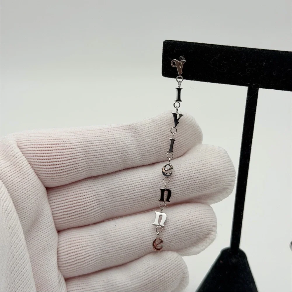 VIVIENNE WESTWOOD RAIMUNDA ASYMMETRICAL LETTER DROP EARRINGS – SILVER TONE - Picture 4 of 6
